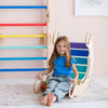 Laden Sie das Bild in den Galerie-Viewer, Una niña pequeña sentada en una silla de colores, una foto de stock de Ottilie Maclaren Wallace, tendencia en Pinterest, Lyco Art, caprichoso, fondo blanco, paleta de colores ricos.