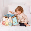 Cargar imagen en el visor de la galería, Una niña pequeña jugando con un juguete en una cama, un rompecabezas de Eden Box, ganador del concurso de Pinterest, Los Automatistas, Adafruit, hecho de cartón, ganador del concurso.