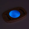 Un objeto de madera con una luz azul dentro de él, un holograma de Évariste Vital Luminais, Behance, Nueva Objecividad, Bioluminiscencia, Luminescencia, Rim Light.