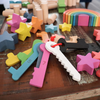 Cargar imagen en el visor de la galería, Una mesa de madera cubierta con muchos juguetes de madera coloridos, un rompecabezas de Manabu Mabe, pixiv, toyism, pixiv, motor de Unreal 5, stockphoto.