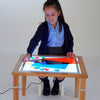 Load image into Gallery viewer, Una niña pequeña sentada en una mesa con una foto en ella, un holograma de Sarah Morris, destacado en dribble, arte interactivo, tecnología futura, arte de juegos 2D, dibujo de un niño.