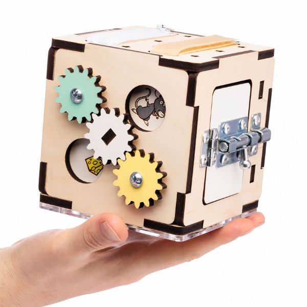 Una mano sosteniendo un juguete de madera con engranajes en él, una escultura abstracta de Eden Box, Pexels, los Automatistes, Tesseract, Adafruit, hecha de cartón.