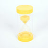 Una reloj de arena con una tapa amarilla sobre un fondo blanco, una representación 3D por Huang Ding, presentada en dribble, precisionismo, skeuomorfismo, velvia, stockphoto.
