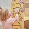 Una niña pequeña jugando con un juguete de madera, un rompecabezas de Ottilie Maclaren Wallace, tendencia en Pinterest, movimiento de artes y manualidades, patrón repetitivo, sala de espejos, Behance HD.
