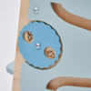 Dos botones de madera sentados en la parte superior de un plato azul, un rompecabezas de Rube Goldberg, destacado en dribble, arte cinético, caprichoso, behance hd, lleno de detalles.
