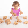 Load image into Gallery viewer, Una niña pequeña jugando con juguetes de madera en una mesa, una foto de stock de Keos Masons, destacada en dribble, movimiento de artes y artesanías, hecho de cartón, patrón repetitivo, trazado de rayos.