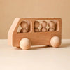 Un coche de juguete de madera con cuatro personas dentro, un render 3D por Ludovit Fulla, presentado en dribble, minimalismo, arte en Instagram, minimalista, minimalista.