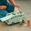 Un niño está jugando con un autobús de juguete, una ilustración de un cuento de Annabel Kidston, presentada en dribble, panfuturismo, hecho de cartón, hecho de plástico, behance hd.