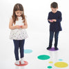 Dos niños jóvenes de pie frente a un fondo blanco, una foto de stock por Toss Woollaston, destacada en dribble arte interactivo, patrón repetitivo, composición dinámica, tecnología futura.