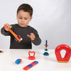 Un joven chico jugando con juguetes en una mesa, una escultura abstracta de Rube Goldberg, destacada en CG Society, De Stijl, ortogonal, composición dinámica, angular.
