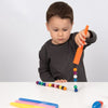 Un joven niño está jugando con un juguete, una foto de stock por Rube Goldberg, ganador del concurso de Shutterstock, Fluxus, foto de stock, efecto Sabattier.
