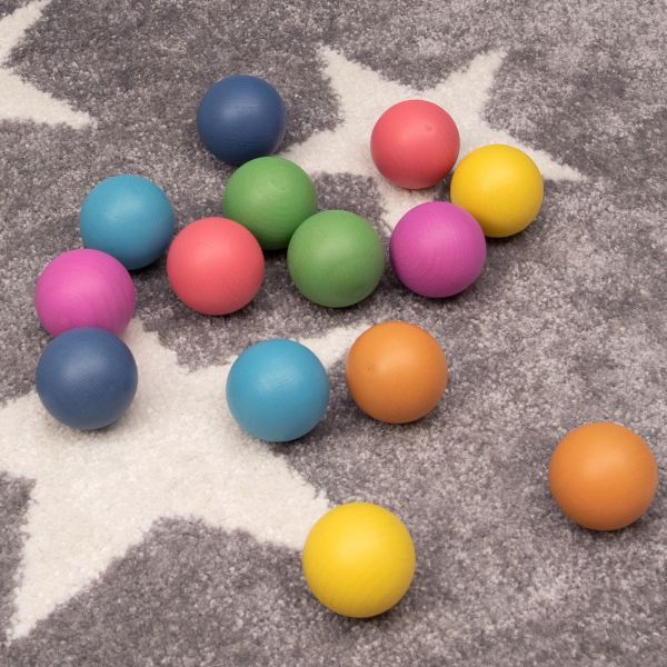 Una pila de bolas de plástico sentada encima de una alfombra, una renderización en 3D creada por Harvey Quaytman, presentada en Dribble, Color Field, Rayo Vray, Renderización Basada en Física, Rayo Vray.