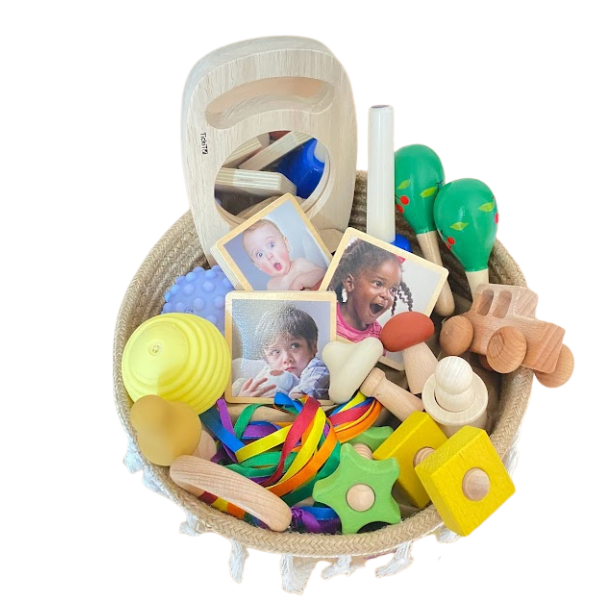 Una cesta llena de muchos juguetes sobre una superficie blanca, una foto de stock por Coppo di Marcovaldo, shutterstock, ensamblaje, foto de stock, stockphoto, hecha de cartón.